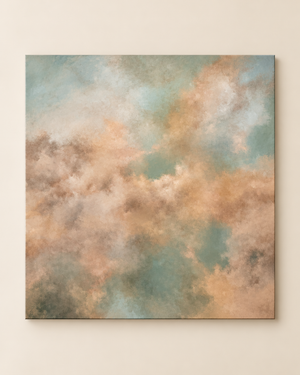 Abstract canvas wall art featuring a textured, painterly cloud-like composition in soft peach, beige, muted teal, and gray tones, displayed against a warm off-white wall.