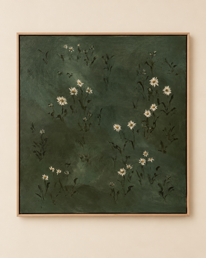 A framed square painting featuring small white daisy-like flowers with dark green stems on a dark green textured background, hung on a light beige wall.